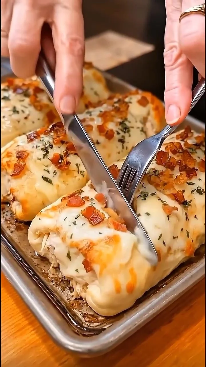 Delicious loaded chicken alfredo stuffed bread sticks ready to be served