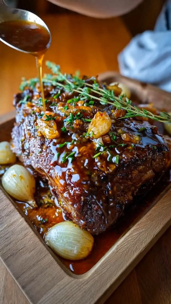 Slow-roasted garlic honey beef shoulder dish served on a platter
