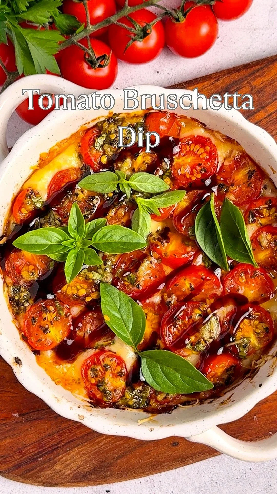 Three Cheese Bruschetta Dip served in a bowl with toast and herbs
